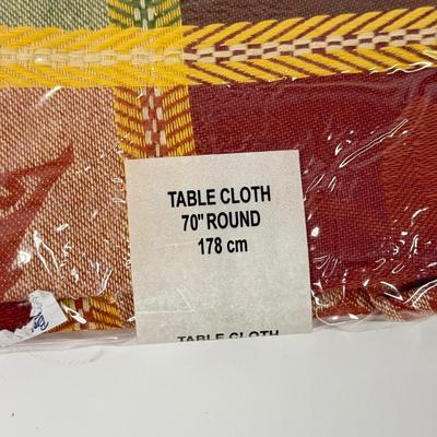 LOT 122: Four NIP Round Tablecloths