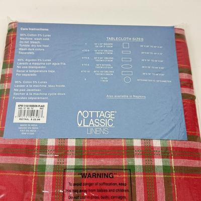 LOT 122: Four NIP Round Tablecloths