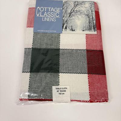 LOT 122: Four NIP Round Tablecloths