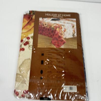 LOT 122: Four NIP Round Tablecloths