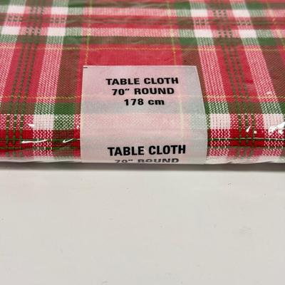 LOT 122: Four NIP Round Tablecloths