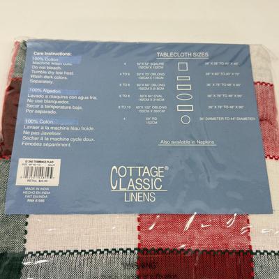 LOT 122: Four NIP Round Tablecloths