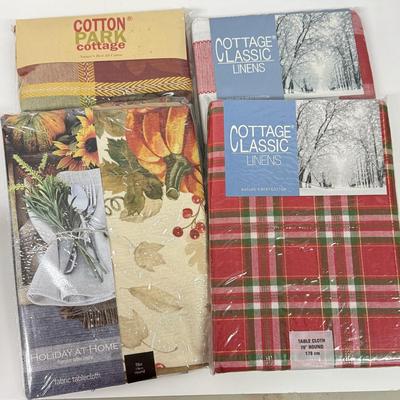 LOT 122: Four NIP Round Tablecloths