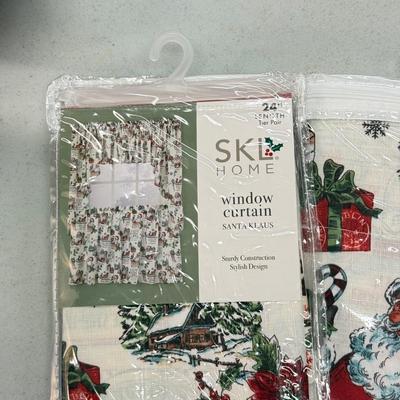 LOT 132: Snowman Christmas Calendar, Santa Tablecloths (NIP) & Hand Made Tree Wall Hanging