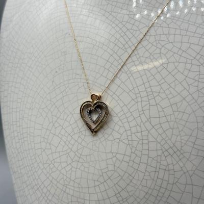 LOT 151: 10kt Gold Heart Pendant on 19" Chain (2.2gtw)