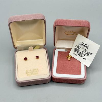 LOT 160: 14kt Gold: Garnet Earrings (0.4g) & Guardian Angel Pin (0.8g)