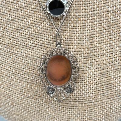 LOT 168: Necklaces: Cameo, Heart Pendants & More