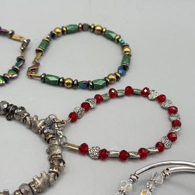 LOT 172: Collection of Charm & Beaded Bracelets