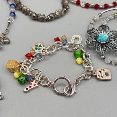 LOT 172: Collection of Charm & Beaded Bracelets