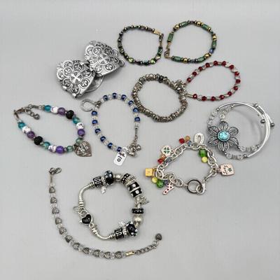 LOT 172: Collection of Charm & Beaded Bracelets