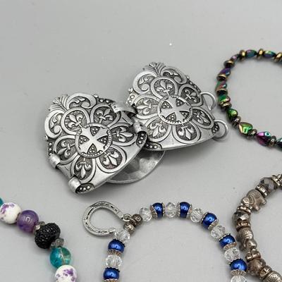 LOT 172: Collection of Charm & Beaded Bracelets