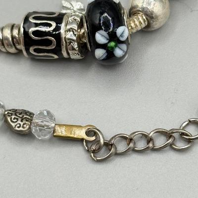 LOT 172: Collection of Charm & Beaded Bracelets
