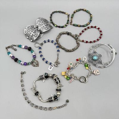 LOT 172: Collection of Charm & Beaded Bracelets