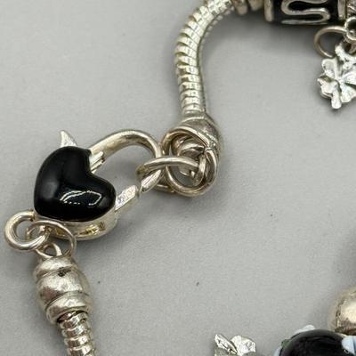 LOT 172: Collection of Charm & Beaded Bracelets