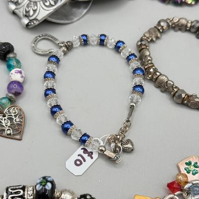 LOT 172: Collection of Charm & Beaded Bracelets
