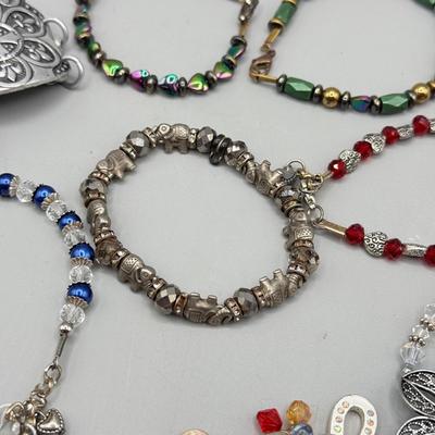 LOT 172: Collection of Charm & Beaded Bracelets