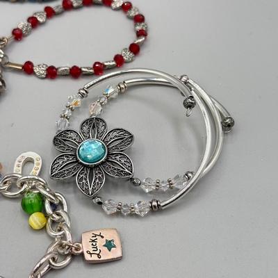 LOT 172: Collection of Charm & Beaded Bracelets