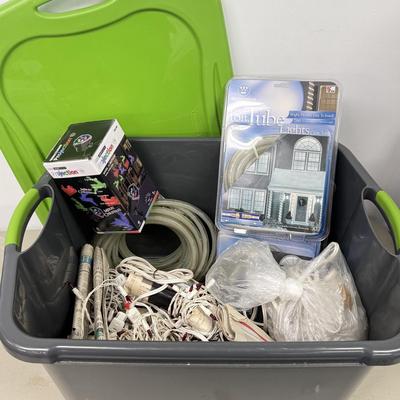 LOT 175: Tote full of White Tube & Red String Lights and a new Gemmy LED Lightshow Projection WHIRL-A-MOTION, heavy duty large tote...