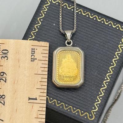 LOT 185: Sterling & Glass Encased Laughing Buddha .999 Gold Bar (4.9g) on 17” Sterling Chain (2.7g)