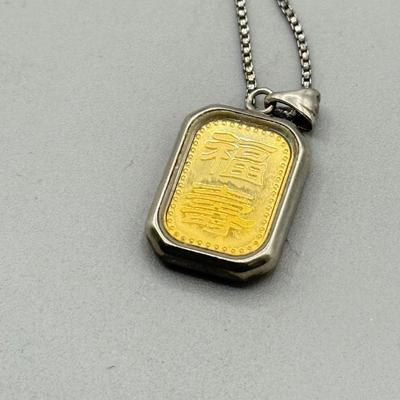 LOT 185: Sterling & Glass Encased Laughing Buddha .999 Gold Bar (4.9g) on 17” Sterling Chain (2.7g)