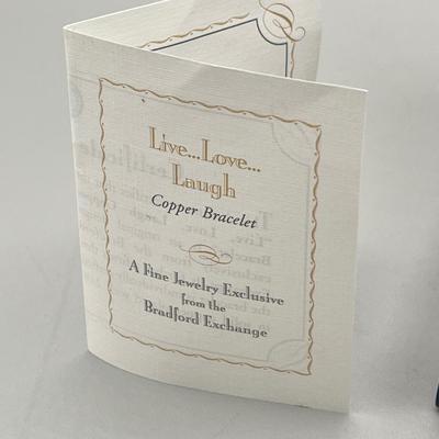 LOT 202: Swarovski Crystal Earrings and Bradford Exchange Copper Bracelet - in Original Boxes