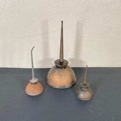 LOT 65: Vintage / Antique Collection - Cast Iron Holders, Wooden Spout, Oil Cans and Berlin 1952 Coin Ashtray