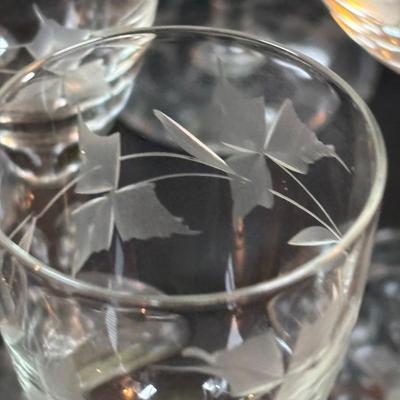 LOT 87: Vintage Hand-Blown Green Glass Wine Decanter & Leather Covered Embossed Spanish Wine Decanter along with Romania Arcadia Crystal