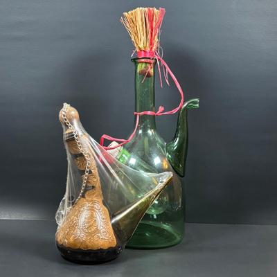 LOT 87: Vintage Hand-Blown Green Glass Wine Decanter & Leather Covered Embossed Spanish Wine Decanter along with Romania Arcadia Crystal