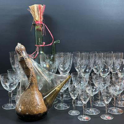 LOT 87: Vintage Hand-Blown Green Glass Wine Decanter & Leather Covered Embossed Spanish Wine Decanter along with Romania Arcadia Crystal