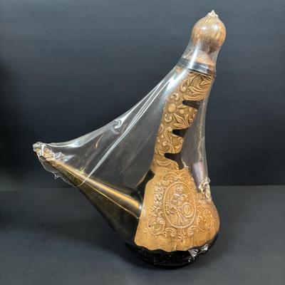 LOT 87: Vintage Hand-Blown Green Glass Wine Decanter & Leather Covered Embossed Spanish Wine Decanter along with Romania Arcadia Crystal