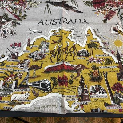 LOT 96: Australia Souvenirs: Copper Faced Clock, Table Linens, Tea Towels, Embossed Wallet, Key Holder