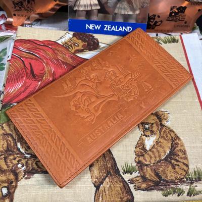 LOT 96: Australia Souvenirs: Copper Faced Clock, Table Linens, Tea Towels, Embossed Wallet, Key Holder