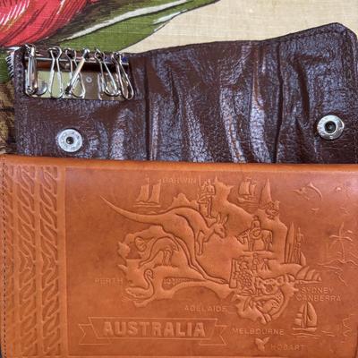 LOT 96: Australia Souvenirs: Copper Faced Clock, Table Linens, Tea Towels, Embossed Wallet, Key Holder