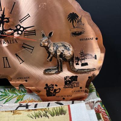 LOT 96: Australia Souvenirs: Copper Faced Clock, Table Linens, Tea Towels, Embossed Wallet, Key Holder