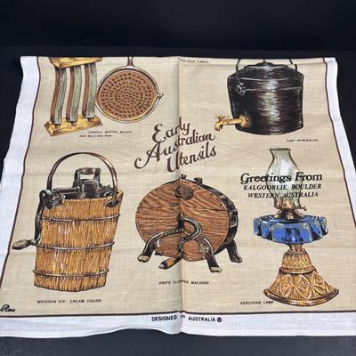 LOT 96: Australia Souvenirs: Copper Faced Clock, Table Linens, Tea Towels, Embossed Wallet, Key Holder