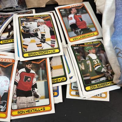 LOT 102: Vintage Philadelphia Flyers Memorabilia: T-shirts, Trading Cards, Team Photos, Stanley Cup Magazine along with a Box of Mixed...