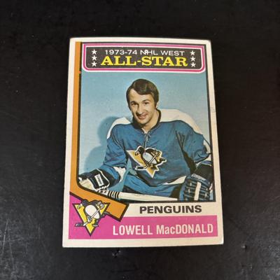 LOT 102: Vintage Philadelphia Flyers Memorabilia: T-shirts, Trading Cards, Team Photos, Stanley Cup Magazine along with a Box of Mixed...