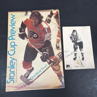 LOT 102: Vintage Philadelphia Flyers Memorabilia: T-shirts, Trading Cards, Team Photos, Stanley Cup Magazine along with a Box of Mixed...