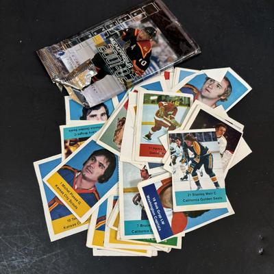 LOT 102: Vintage Philadelphia Flyers Memorabilia: T-shirts, Trading Cards, Team Photos, Stanley Cup Magazine along with a Box of Mixed...