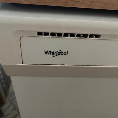 Sale Photo Thumbnail #152: Portable whirlpool dishwasher that has wheels and can be freely rolled around your cooking space.  The top is a flat surface that can be used as counter space.  
Power cable and hose are both on the back of the unit and retract into the unit when not in u