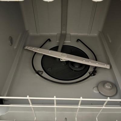 Sale Photo Thumbnail #154: Portable whirlpool dishwasher that has wheels and can be freely rolled around your cooking space.  The top is a flat surface that can be used as counter space.  
Power cable and hose are both on the back of the unit and retract into the unit when not in u