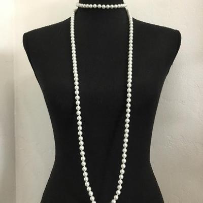 Beautiful very nice double knotted White faux pearl, long flapper style necklace