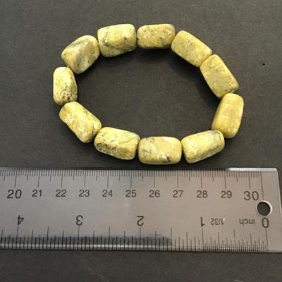 Sale Photo Thumbnail #29: Very nice green polished stone stretchy bracelet. Please see attached photos.