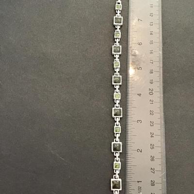 Sale Photo Thumbnail #43: Beautiful Silvertone faux plastic stone tennis bracelet. Please see attached photos.