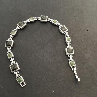 Sale Photo Thumbnail #44: Beautiful Silvertone faux plastic stone tennis bracelet. Please see attached photos.