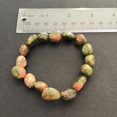 Sale Photo Thumbnail #61: Beautiful, green polished stone stretchy bracelet. Please see attached photos.