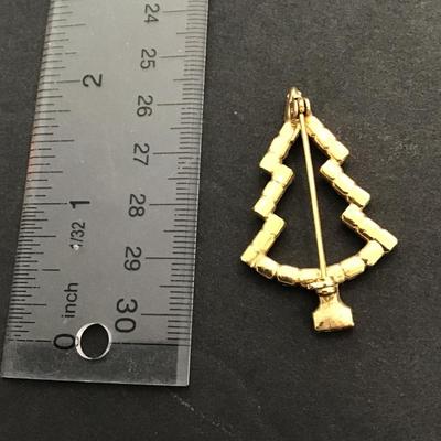 Sale Photo Thumbnail #81: vintage goldtone Christmas tree brooch with green rhinestone. Please see attached photos.