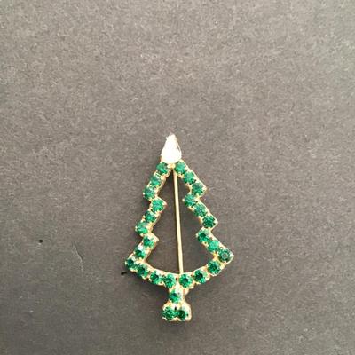 Sale Photo Thumbnail #80: vintage goldtone Christmas tree brooch with green rhinestone. Please see attached photos.