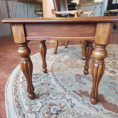 Sale Photo Thumbnail #31: Square side table crafted from cherry wood, featuring a 2x2x2. The tabletop includes a decorative inlay detail around the center panel. Supported by four intricately carved wooden legs. Suitable for various interior decor styles.