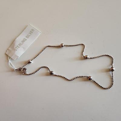 Sale Photo Thumbnail #13: This auction lot is for a collection of Jewelry with Sterling Silver Balls.  This offering includes a bracelet with original tag attached and two necklaces one measures 23-inches and the other 25-inches - both with cascading sterling silver balls. All are